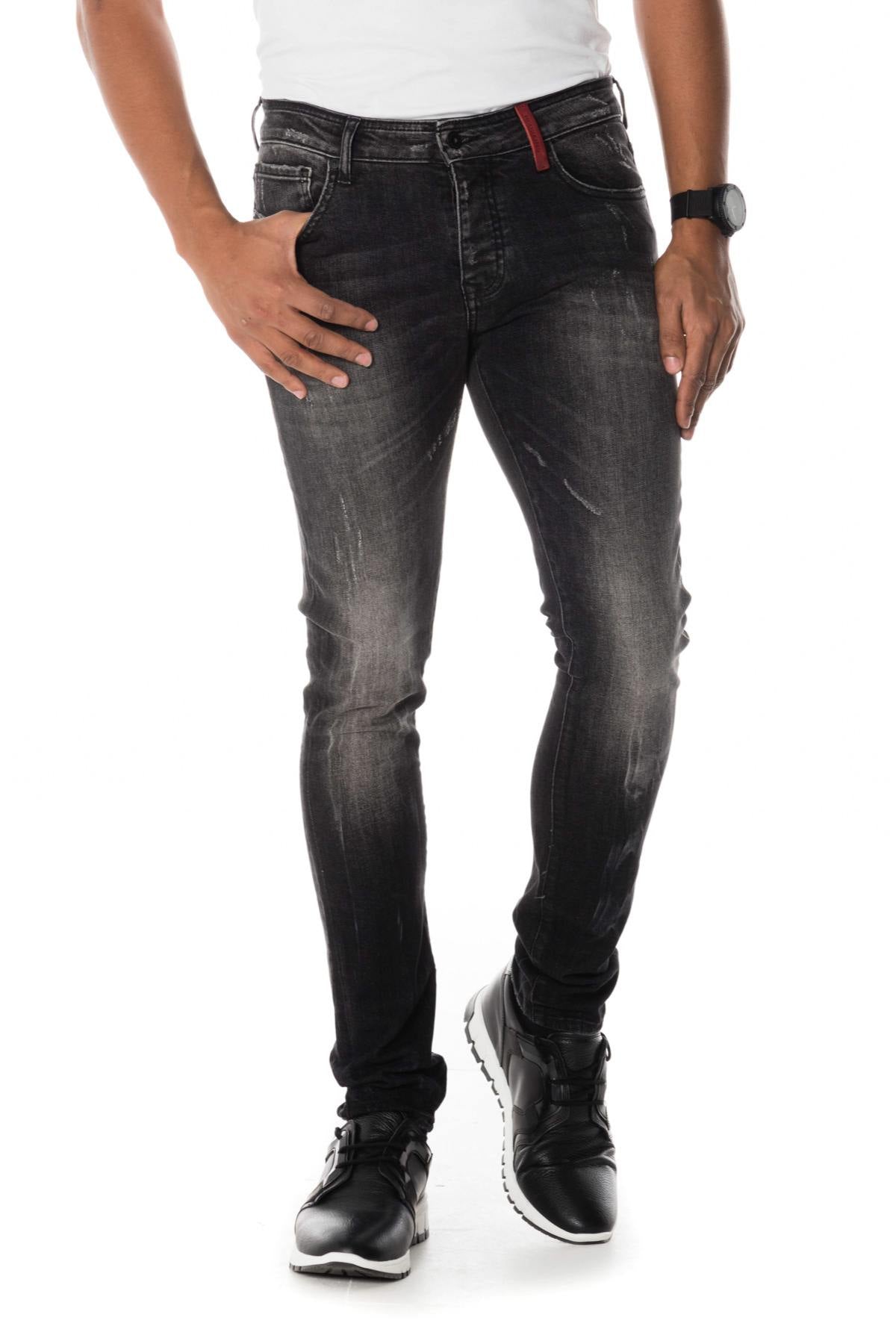 Distressed and washed slim-fit jeans - Image n°1