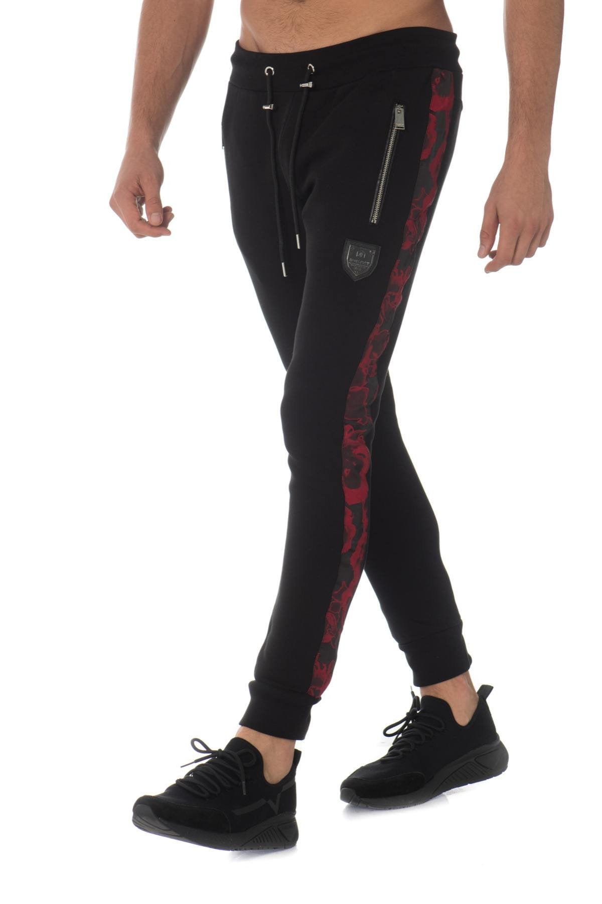 Black jogging pants with red contrasting stripe - Image n°1