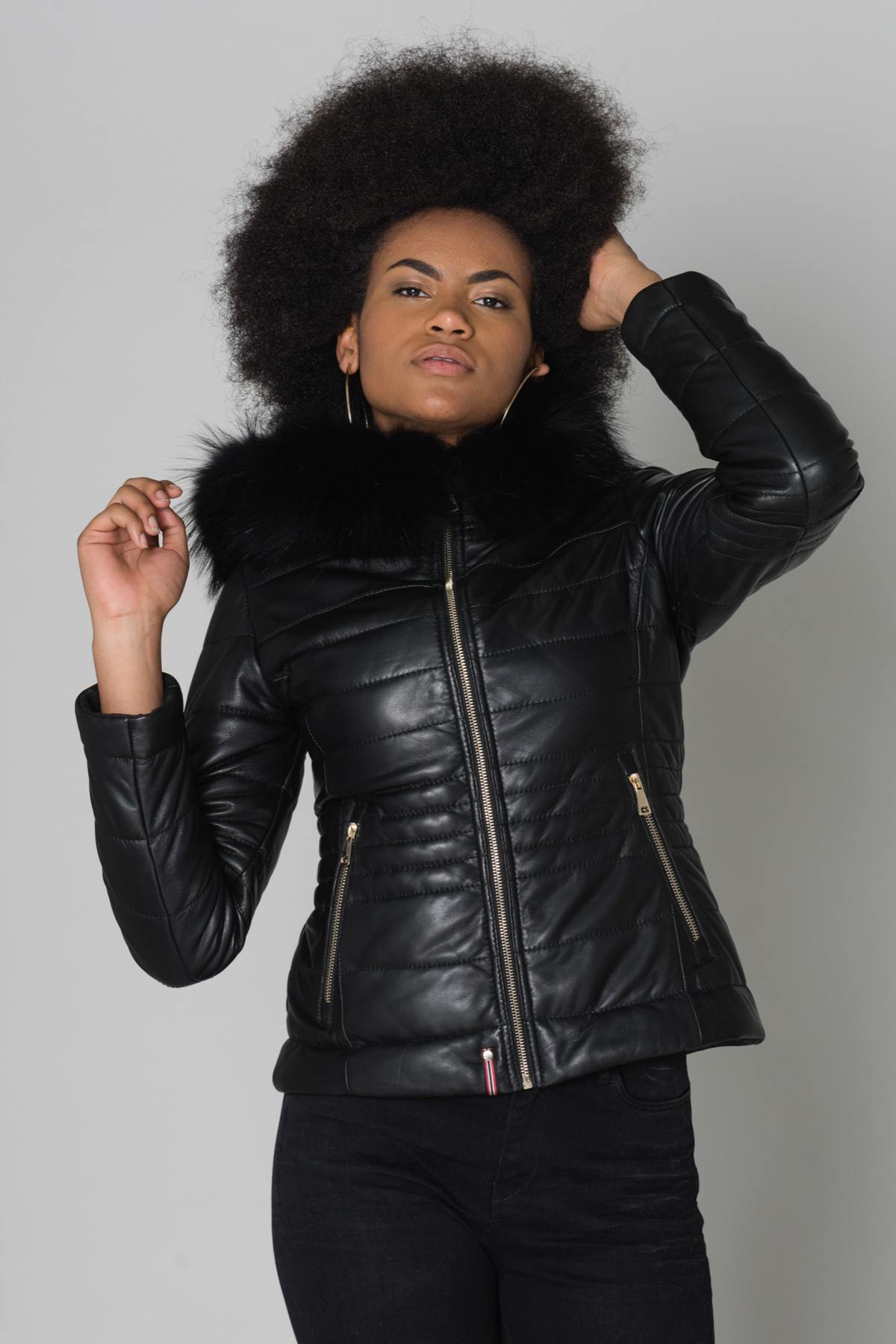 Women's down jacket in black sheepskin leather with black raccoon fur - Image n°1