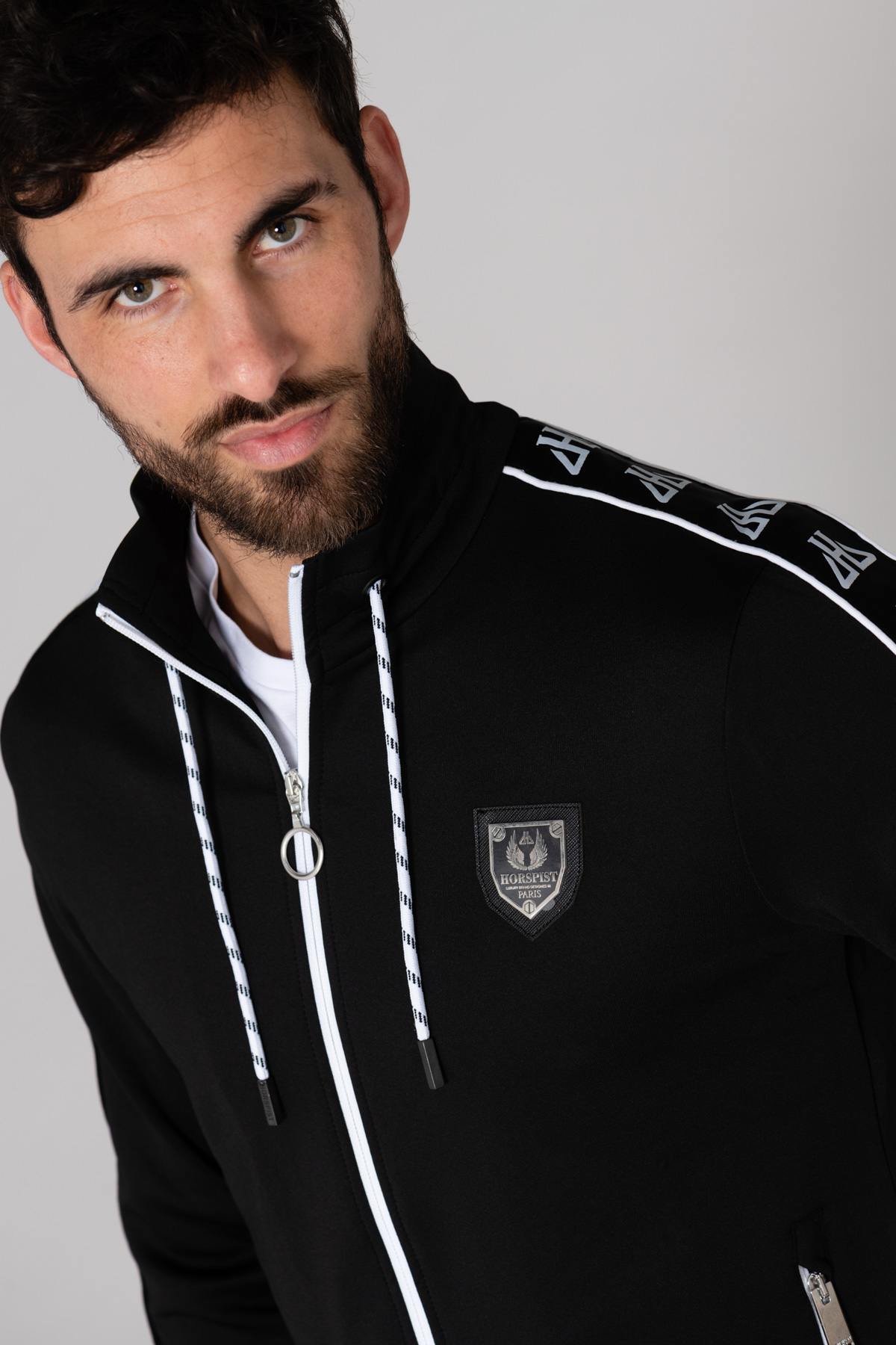 Black jogging jacket with white piping - Image n°1