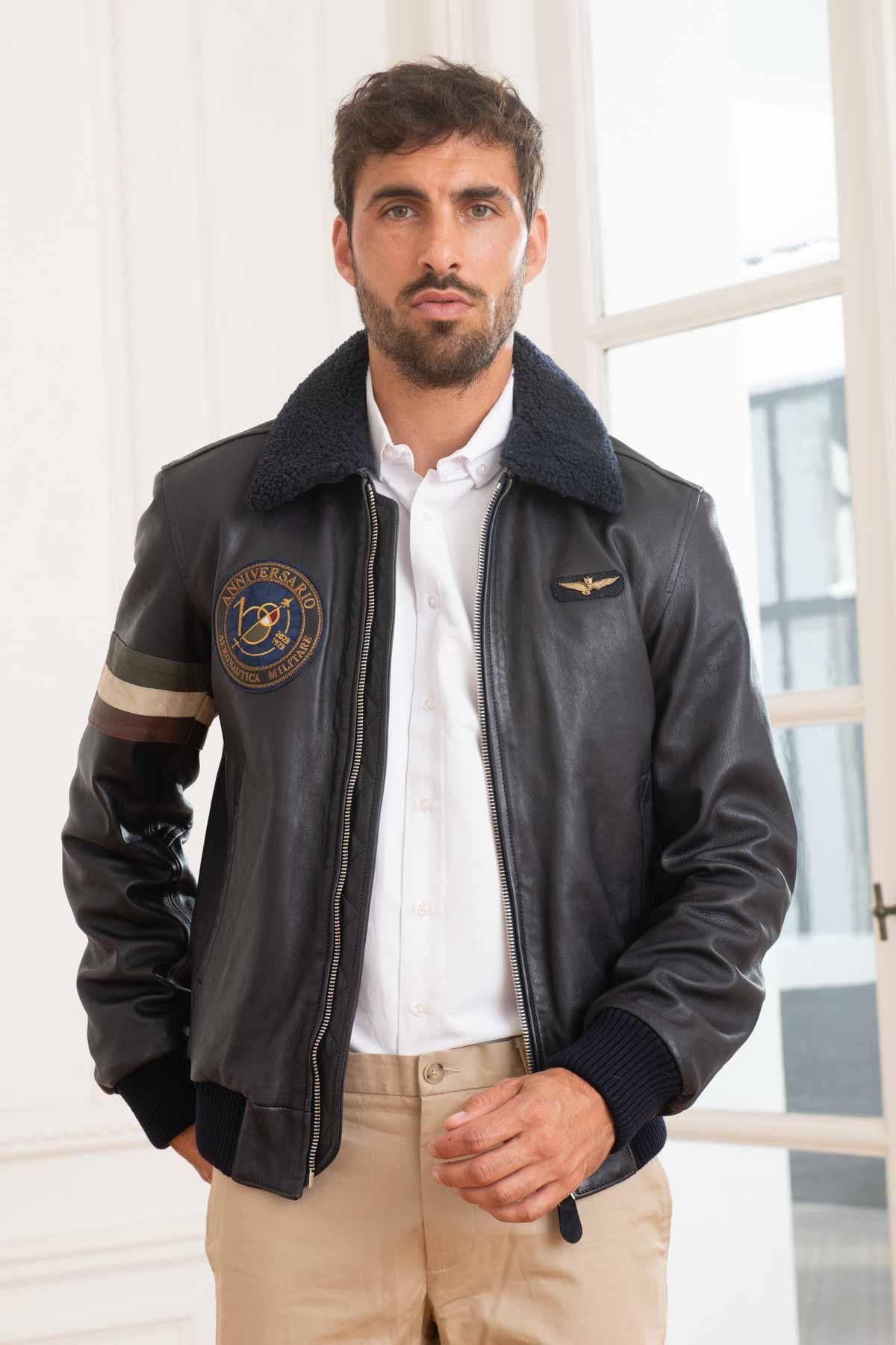 Men's navy blue leather bomber jacket 100 years edition - Image n°1