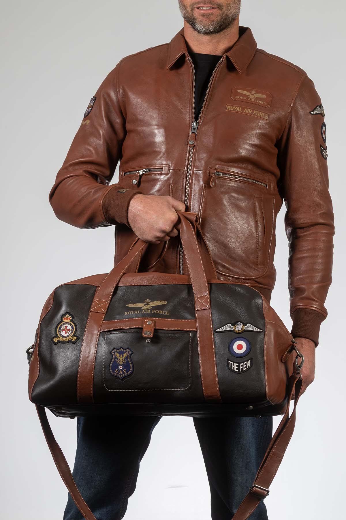 Dark brown leather travel bag with patches - Image n°1