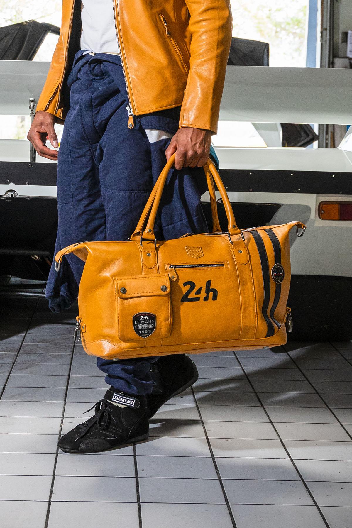 Yellow leather racing style travel bag - Image n°1