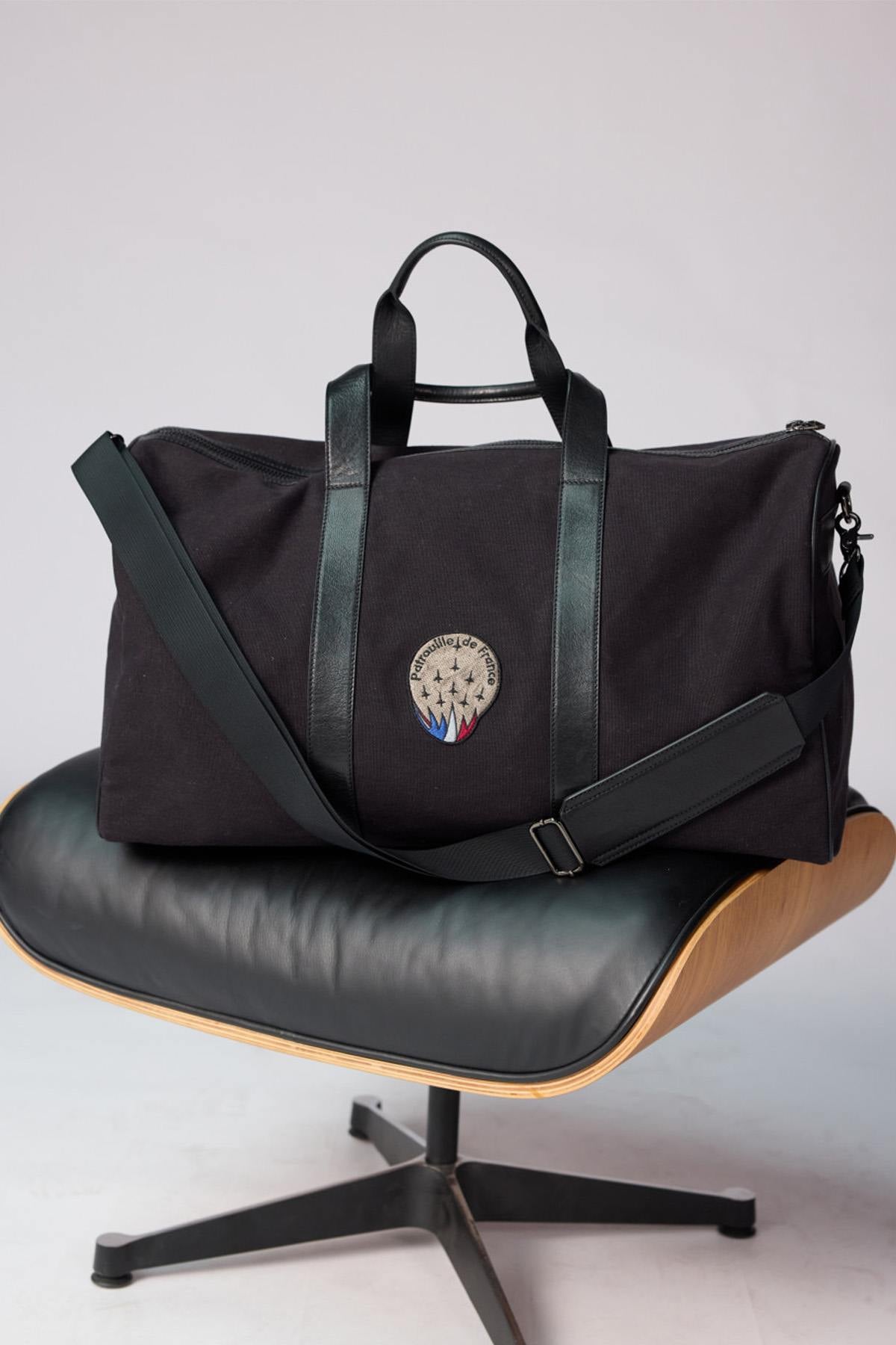 Cotton canvas and cowhide leather travel bag with patches - Image n°1