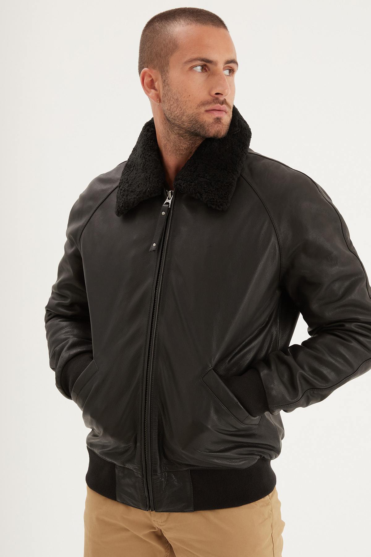 Black thick leather bomber jacket with fur collar - Image n°1