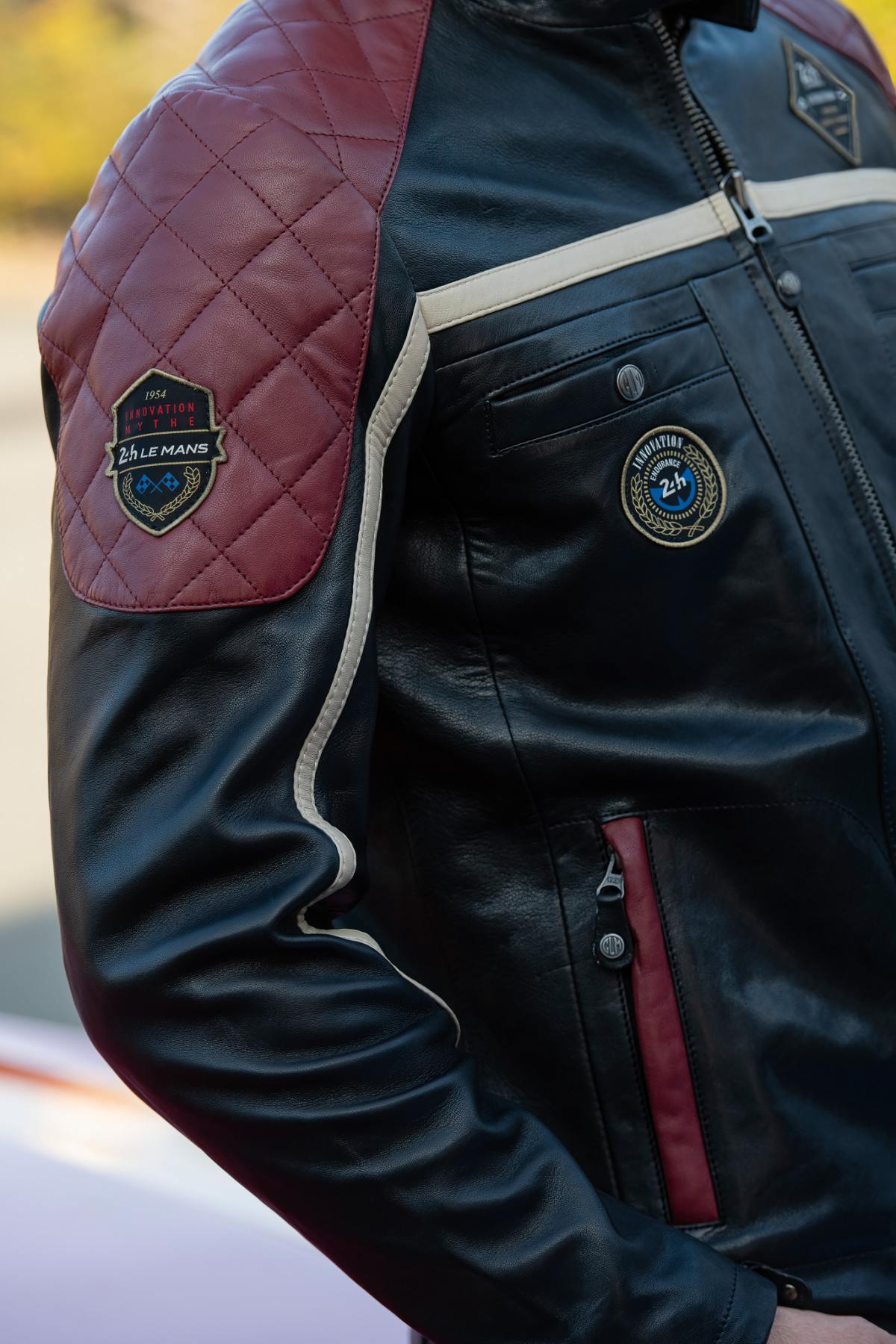 Black leather jacket with red inserts and quilted shoulders - Image n°2