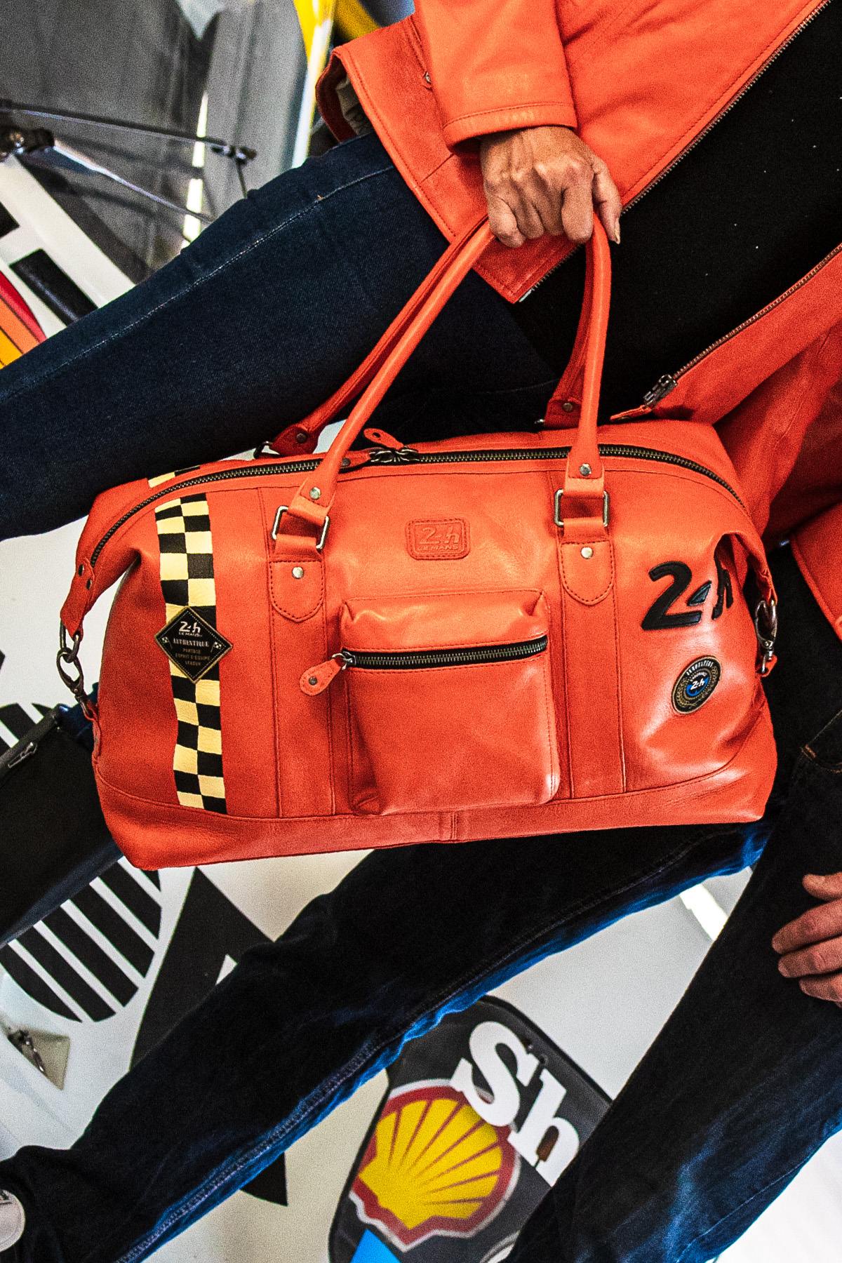 Orange leather travel bag with racing checkerboard - Image n°1