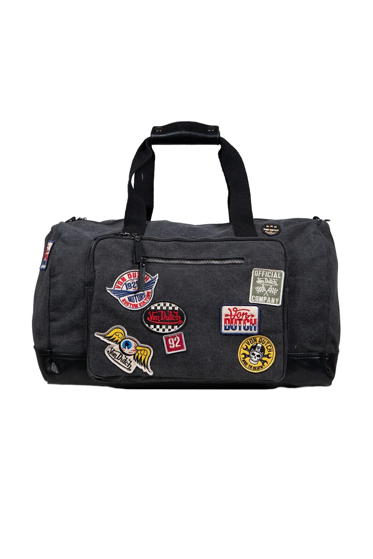 Grey travel bag with patches - Image n°1