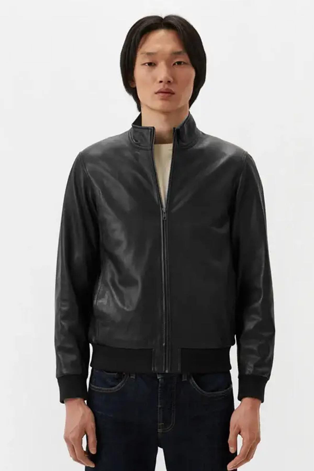 Black leather jacket with stand-up collar and ribbed edges - Image n°1