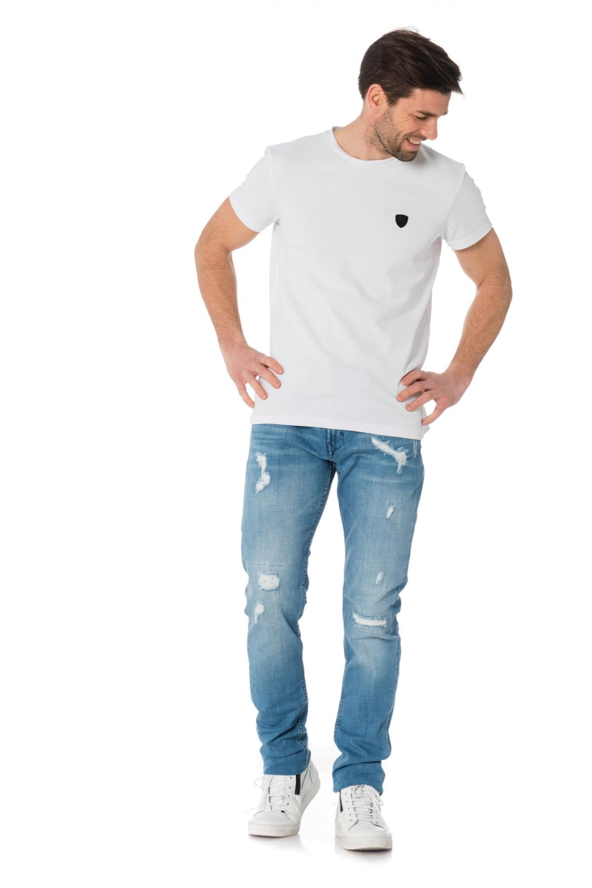 Men's light blue jeans with worn and torn effect - Image n°3