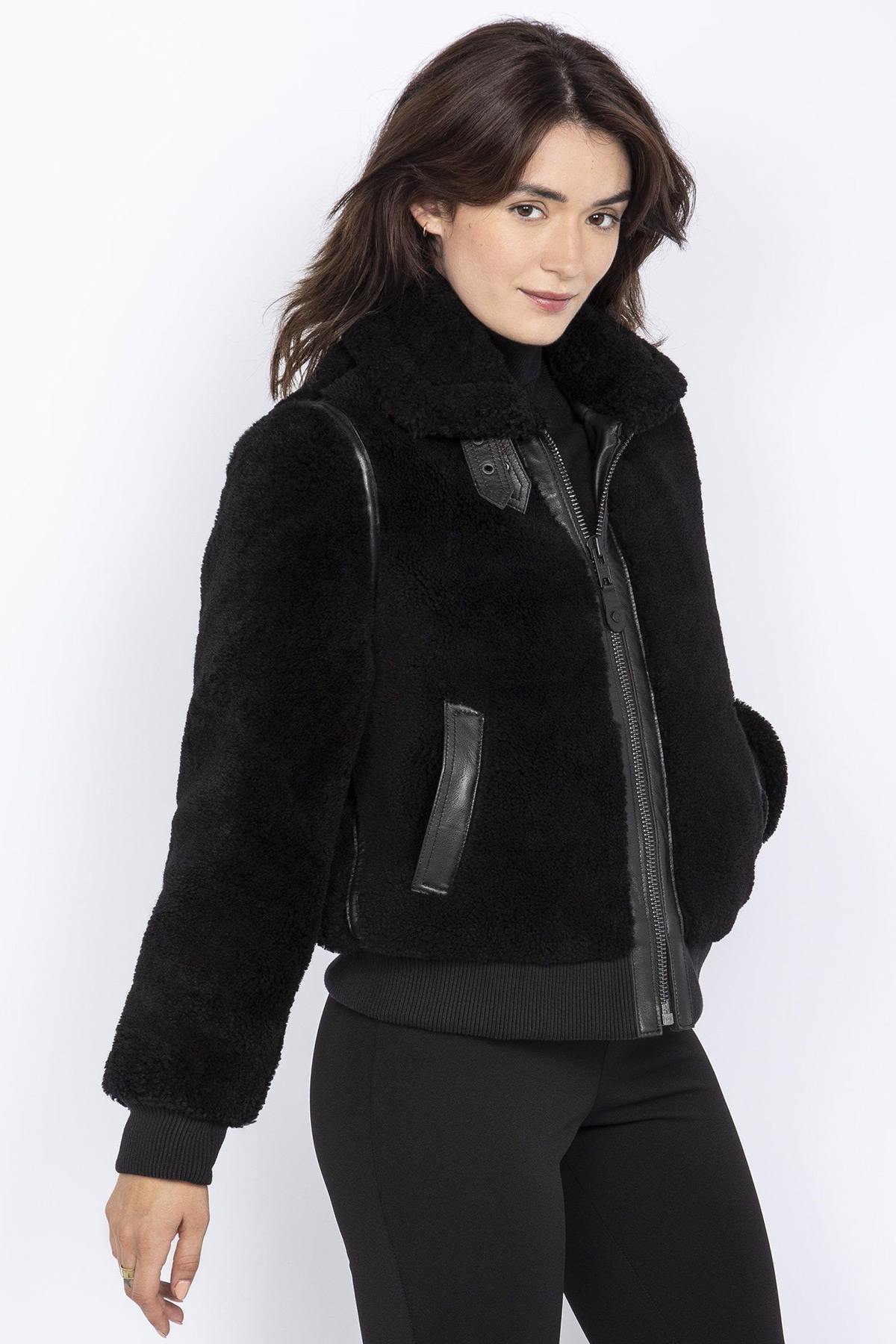 Women's black bomber jacket in shearling and leather details - Image n°1