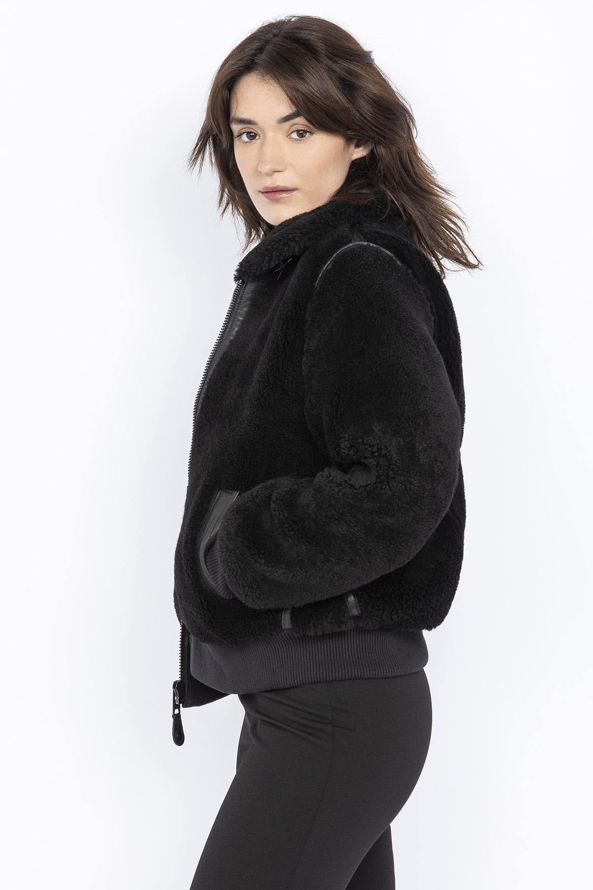 Women's black bomber jacket in shearling and leather details - Image n°2